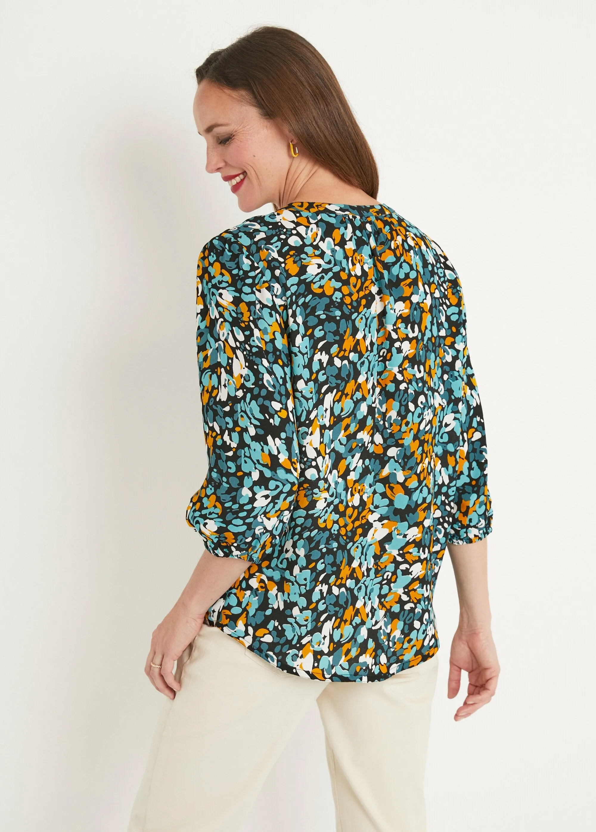 Long, loose-fitting button-down tunic