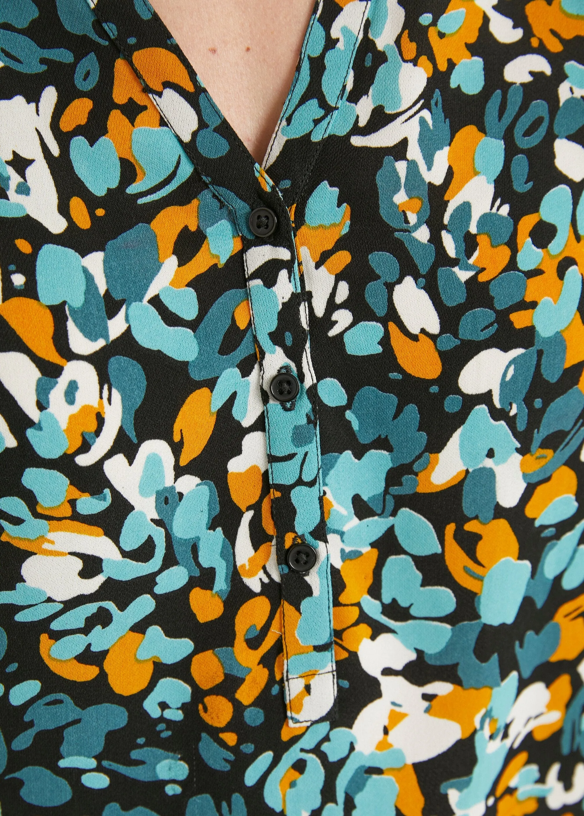 Long, loose-fitting button-down tunic