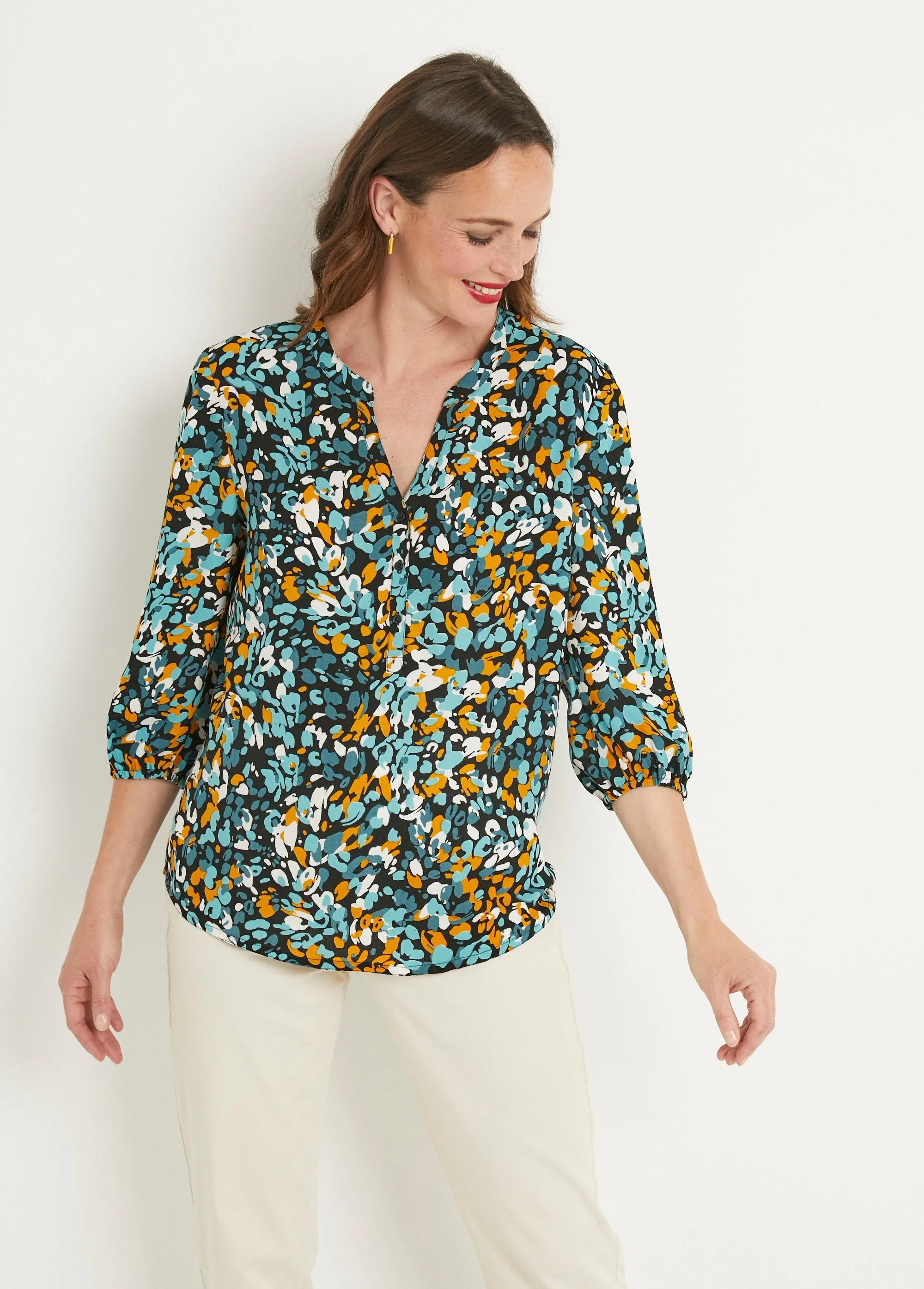 Long, loose-fitting button-down tunic