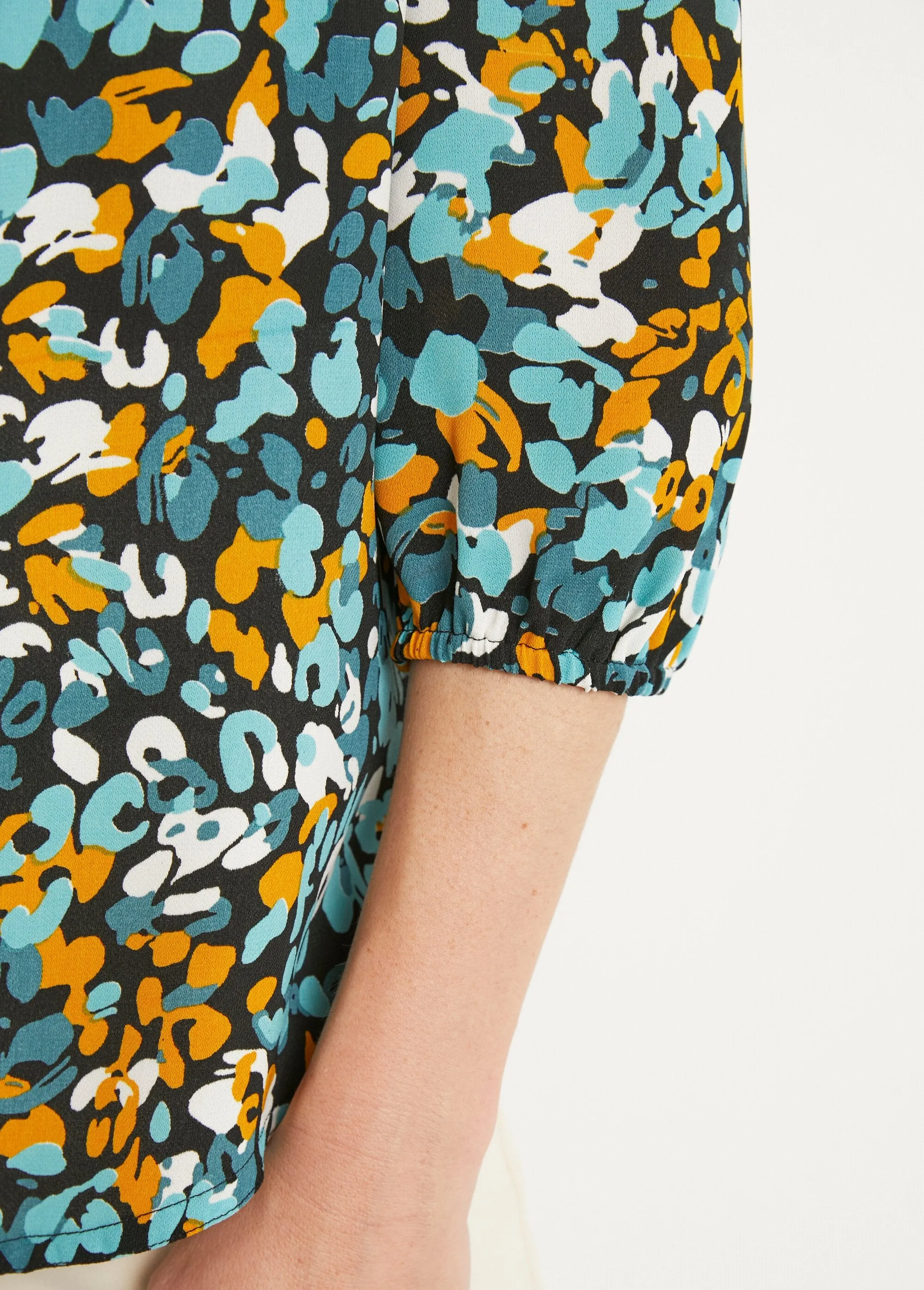 Long, loose-fitting button-down tunic